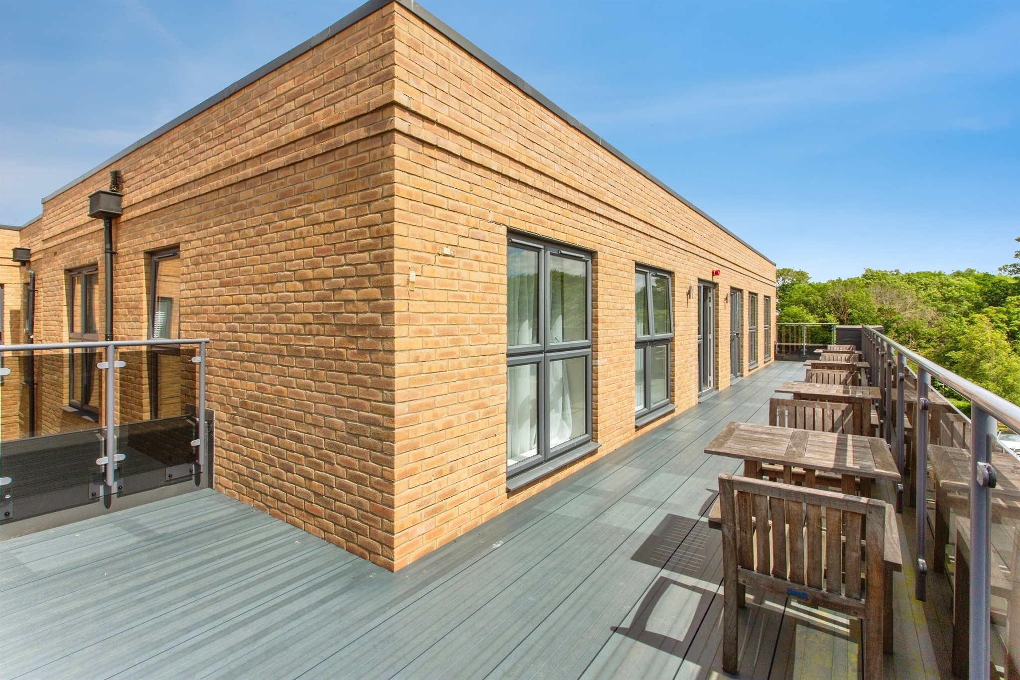Communal roof terrace with outdoor seating at Uplands Place